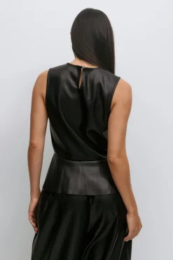 Pu peplum top